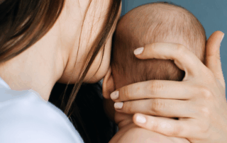 mother holding newborn baby