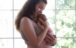 mother holding baby